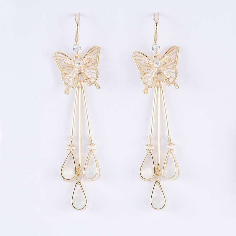 Messing-Quastenohrring mit Schmetterling zum Verkauf zwischen 1,0 und 1,6 US-Dollar